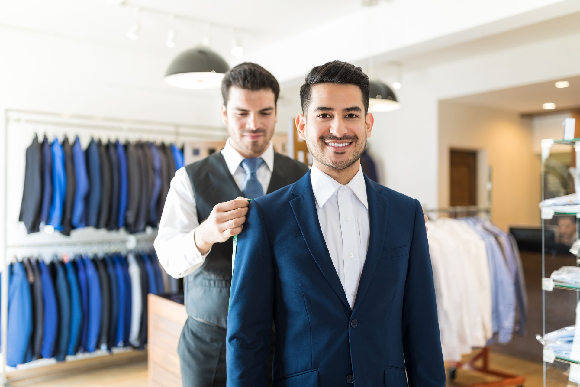 Happy Customer Visiting Tailor To Buy Custom Made Suit