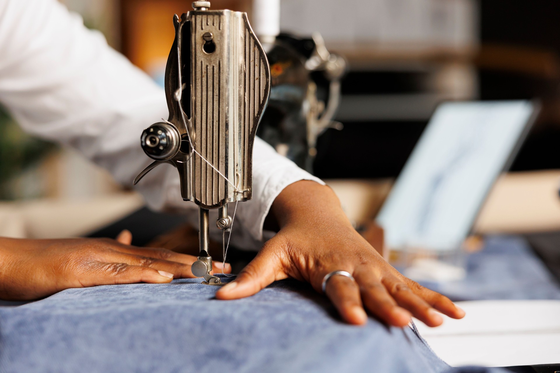 Close up of seamstress sewing machine